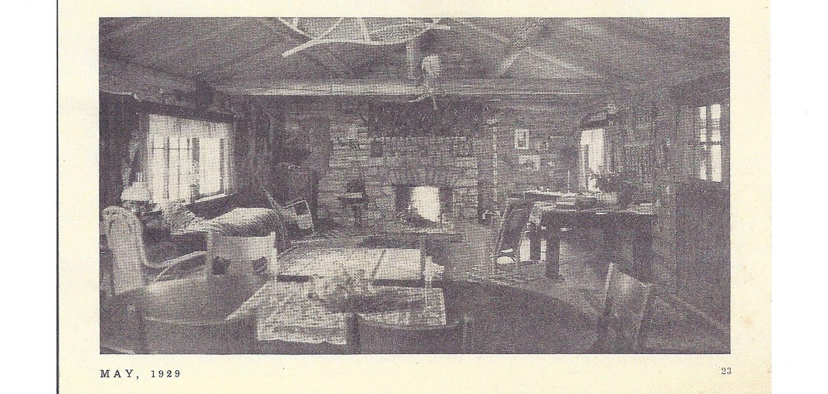 The lounge at Elephant Head Lodge with stone fireplace, Navajo rugs, and rustic furnishings, 1929